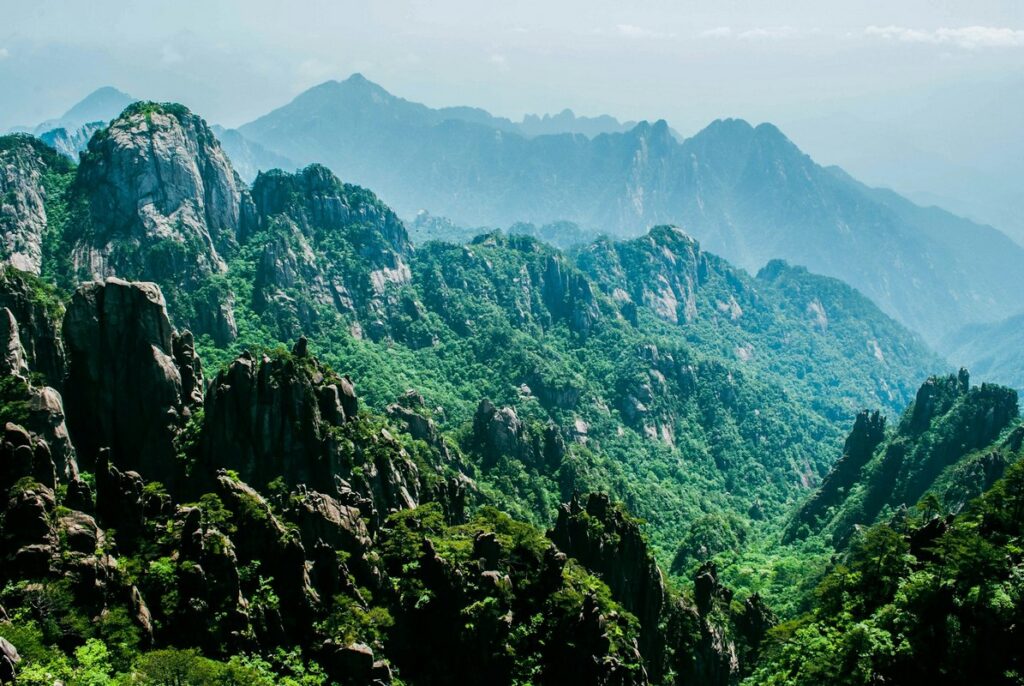 a mountain range with trees and rocks yellow mountain of china